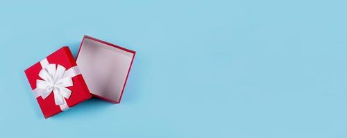 Open red gift box. Top view, flat lay. Mockup, holiday concept. Banner image for website, design photo
