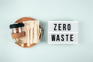 Sustainable, plastic free, zero waste concept. Eco friendly cutlery, eco bag, reusable coffee mug photo