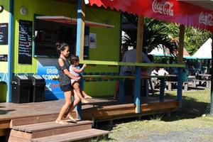 RAROTONGA, COOK ISLANDS - AUGUST 19 2017 - Tourist and locals at popular Saturday Market photo