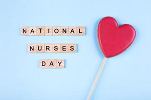 International Nurses Day, May 6. Healthcare medicine concept. Top view, flat lay. Heart Sweet Gift photo