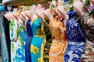 colorful pareo and polynesian dress for sale at market photo