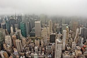 new york manhattan cityscape aerial view on foggy day photo