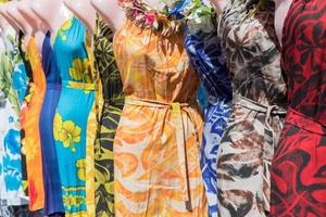 colorful pareo and polynesian dress for sale at market photo