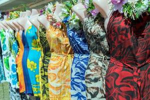 colorful pareo and polynesian dress for sale at market photo