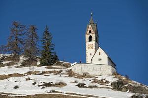 mountain church in winter photo