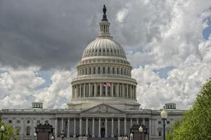 Washington DC Capitol view from the mall on cloudy sky photo