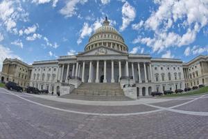 Full Washington DC Capitol on cloudy sky photo