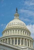 Dome of Washington DC Capitol on cloudy sky photo