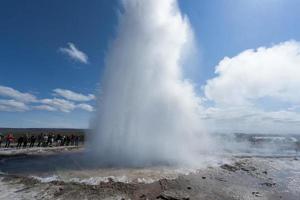 Geyser eruption in Iceland while blowing water photo