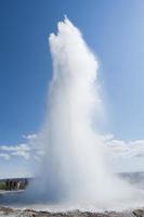 Geyser eruption in Iceland while blowing water photo