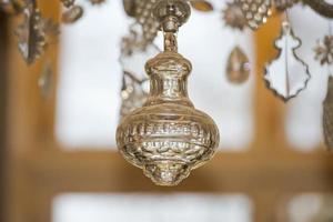 glass pendant detail of hall chandelier photo