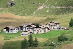 swiss mountain village on sunny summer day photo