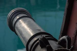 iron cannon on sail ship photo