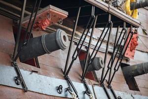 iron cannon on sail ship photo