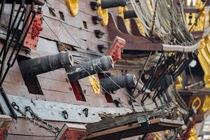 iron cannon on sail ship photo