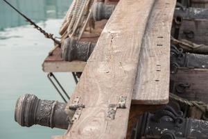 iron cannon on sail ship photo