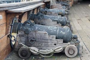 iron cannon on sail ship photo