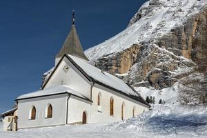 mountain church in winter photo