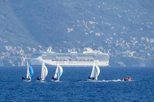 small sail boat regatta near shore photo