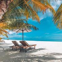 Vintage tranquil beach lounge chairs and umbrella. Summer holiday and vacation concept background. Inspirational tropical landscape design. Tourism and travel design, resort filter resort beach photo