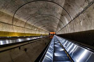 Underground Metro subway moving escalator