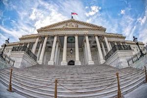 Washington DC Capitol on sunny cloudy sky background photo