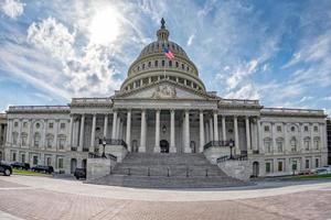 Washington DC Capitol on sunny cloudy sky background photo