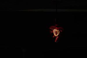 heart shaped light glowing in the dark photo