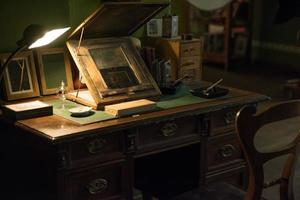 ancient working desk with lamp photo