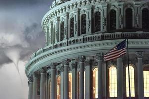 illuminated dc capitol at night in washington usa with tornado photo