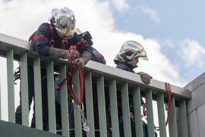 PARIS, FRANCE - MAY, 3 2016 - Firemen in action on a bridge photo
