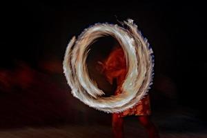 Cook Islands polynesian dancer flames isolated on black photo