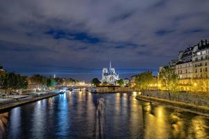 paris notre dame dome at night photo