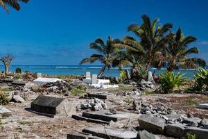 Cemetery on tropical coconut pacific ocean beach photo