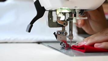 Woman hands using the sewing machine. Tailoring concept. Making and repairing clothes. Designing and dressmaking video