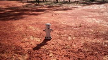 old rusted fire hydrant in desert photo