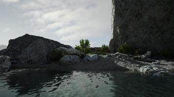 Rock cliff and emerald sea in island photo