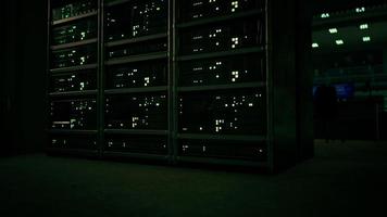 data center with multiple rows of fully operational server racks photo