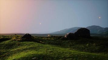 Mountain valley during bright sunrise photo