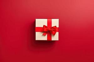 photo of a gift box with a red bow and hearts on a red background