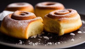 dvertising professional food photography close up of a pile of cinnamon rolls covered in sugar photo