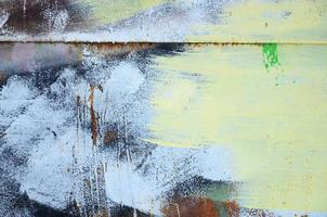 A large fragment of the graffiti pattern applied to the wall with aerosol paint. The gradient between several colors is carried out by spraying the paint. Abstract background image photo