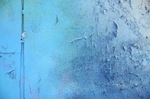 A large fragment of the graffiti pattern applied to the wall with aerosol paint. The gradient between several colors is carried out by spraying the paint. Abstract background image photo