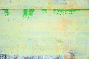A large fragment of the graffiti pattern applied to the wall with aerosol paint. The gradient between several colors is carried out by spraying the paint. Abstract background image photo