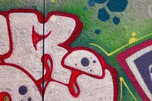 Street art. Abstract background image of a fragment of a colored graffiti painting in chrome and red tones photo