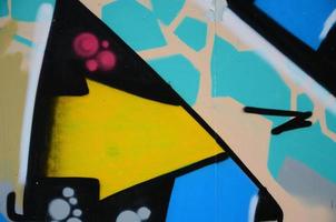 Street art. Abstract background image of a fragment of a colored graffiti painting in blue tones photo