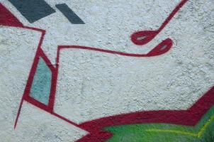 Street art. Abstract background image of a fragment of a colored graffiti painting in chrome and red tones photo