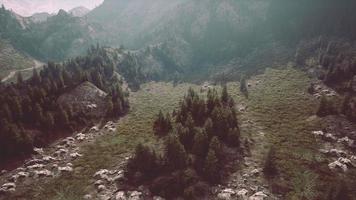 cross road on hillside meadow in mountains photo