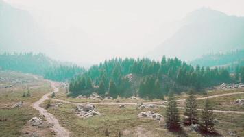 cross road on hillside meadow in mountains photo