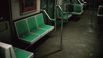 Empty benches of metro wagon photo